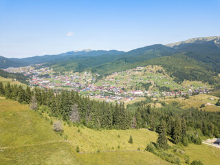 Obraz premium Green mountains of Ukrainian Carpathians in summer. Sunny clear day. Aerial drone view.