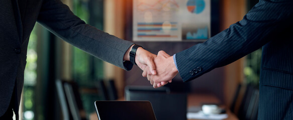 Cropped shot of businessman handshake for teamwork of business merger and acquisition.