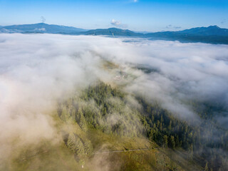 Foggy summer morning in the Ukrainian Carpathians. Aerial drone view.