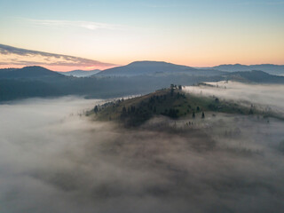 Naklejka premium Morning fog in the Ukrainian Carpathians. Aerial drone view.