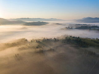Morning fog in the Ukrainian Carpathians. Aerial drone view.