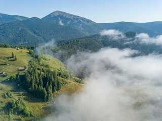 Morning fog in the Ukrainian Carpathians. Aerial drone view.