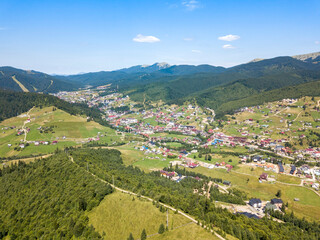 Mountain settlement in the Ukrainian Carpathians. Aerial drone view.