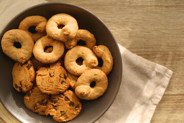 Plate of sugar cookies and chocolate chip cookies on the table. Flat lay.