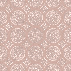 Fototapeta na wymiar Oriental ornamental seamless mandala pattern with lacy ornaments on pastel pinkish background. Print for fabric wallpaper