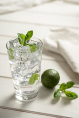 Fresh glass of soda water garnish herb