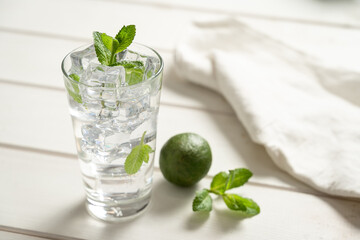 Fresh glass of soda water garnish herb