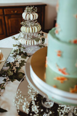 wedding table with sweets. wedding cake. sweets. cupcakes.