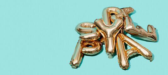 Fototapeta golden letter-shaped balloons, banner format obraz