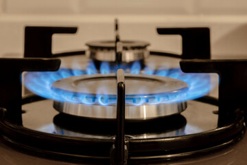 Flame On  Stove burner, close-Up Of Gas Stove Burners. Selective focus burner.  Selectice Focus Front view.