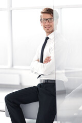 businessman standing in bright office