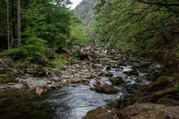 Fast flowing water/waterfalls flowing through the Aberglaslyn Pass near to Beddgelert, in Snowdonia...