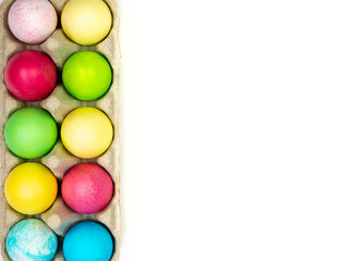 Fototapeta na wymiar Multicolored painted eggs on a white background. Easter Concept