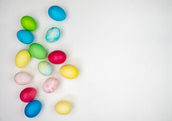 Multicolored painted eggs on a white background. Easter Concept