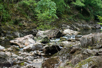 Fast flowing water/waterfalls flowing through the Aberglaslyn Pass near to Beddgelert, in Snowdonia National Park, north Wales