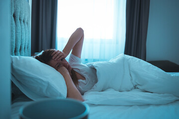 Photo Young Contemplated Woman Lying On BedPhoto Young Contemplated Woman Lying On Bed. Woman with...
