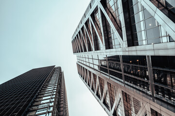 Urban landscape of steel and glass. Futuristic architecture and sky. Split tone processing.