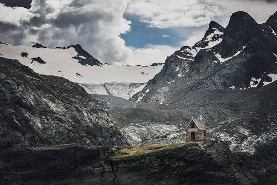 mountain church in front of the rutor glacier