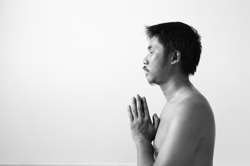 portrait of man doing yoga in room.