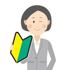 初心者マークを持つビジネスパーソン