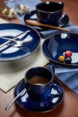 Coffee and fruit in blue cutlery