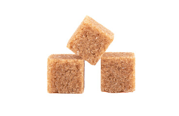 Three cubes of refined cane sugar isolated on white background.