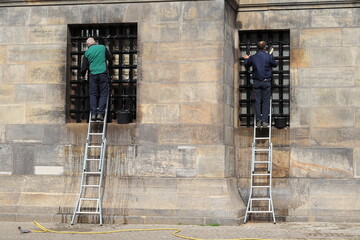 Amsterdam Royal Palace Exterior Close Up with Window Cleaners on Ladders, Netherlands