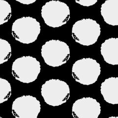 Vector black and white textured polka dots seamless design.