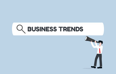Searching for upcoming business trend, seeking opportunity for investment, or looking for new career path. Businessman using telescope to see word BUSINESS TREND inside search bar.