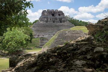 Fototapeta na wymiar Pyramid 'El Castillo' behind smaller Maya ruins at the archeological site Xunantunich near San Ignacio, Belize
