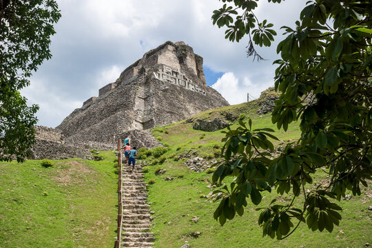 Tourists climbing the steep stairs to the Maya ruin 'El Castillo' at the archeological site Xunantunich near San Ignacio, Belize