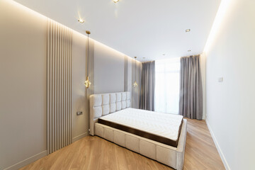Fototapeta na wymiar new bright and stylish interior design of the room with a bed