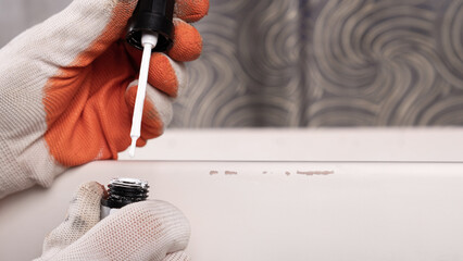 the restorer paints the damaged furniture,varnish for wood