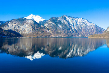 Amazing aerial view of Lake Hallstatt in Austria. The Hallstätter Lake is one of the most famous lakes in the upper austrian Salzkammergut. Dachstein mountains in the background. Hallstatt, Austria