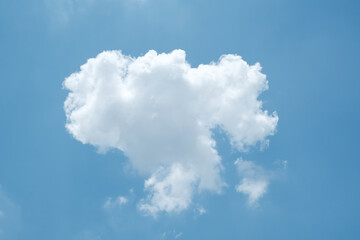 White fluffy cloud in the deep blue sky, single cloud natural background