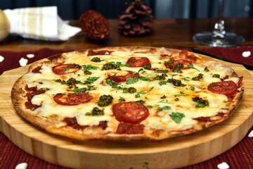 pizza is a dish of Italian origin consisting of a usually round, flat base of leavened wheat-based dough topped with tomatoes, cheese, and often various other ingredients, which is then baked at a hig