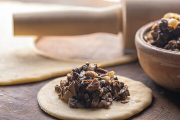 preparing dumplings with mushroom stuffing for Christmas