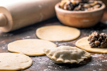 preparing dumplings with mushroom stuffing for Christmas