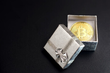 Bitcoin coin in a gift box the concept of crypto currency the best gift