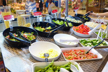 Fresh colorful vegetable and cereal on salad bar in restaurant