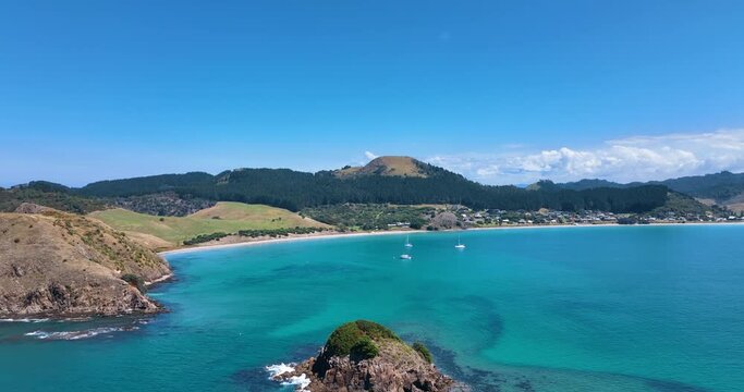 Flight over the turquoise waters of Opito Bay and offshore isles - Aotearoa