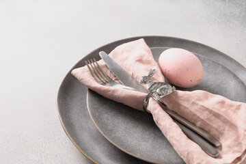 Easter dinner with pink egg, elegance table setting. Top view. Copy space.