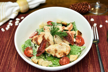 A salad is a dish consisting of mixed, mostly natural ingredients with at least one raw ingredient. 