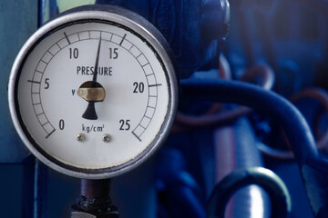 pressure gauge installed on hydraulic pump with motor, solenoid valve, pipe. in factory.