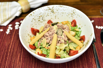 A salad is a dish consisting of mixed, mostly natural ingredients with at least one raw ingredient. 