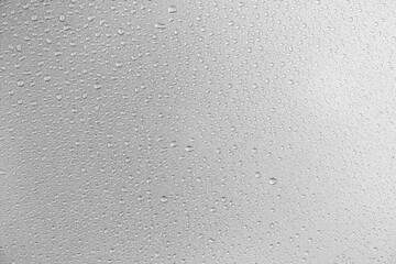 Water droplets on gray background covered with water droplets, bubbles in water.