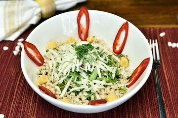 A salad is a dish consisting of mixed, mostly natural ingredients with at least one raw ingredient. 