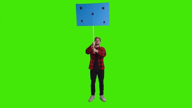 A man is protesting alone and shaking a banner playcard in his hands on greenscreen