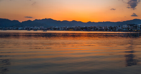 Fototapeta na wymiar MARMARIS, TURKEY: Beautiful landscape with a view of the sea and the town of Marmaris at sunset.