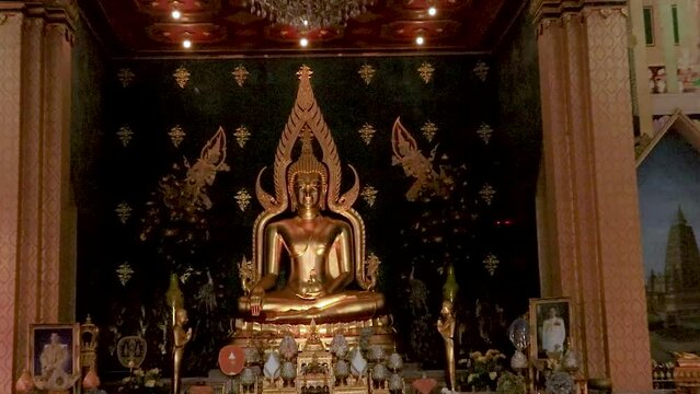 golden buddha statue at monastery from flat angle video taken at thai monastery bodh gaya bihar india on Feb 11 2020.
